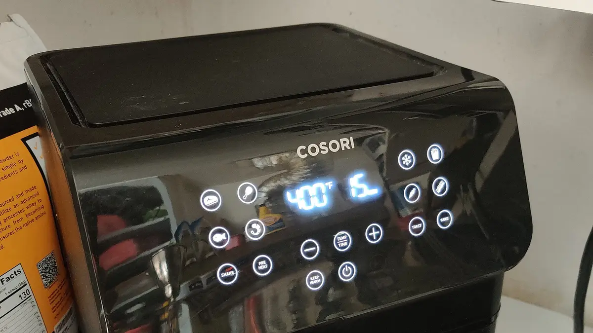 Digital air fryer panel showing temperature and time