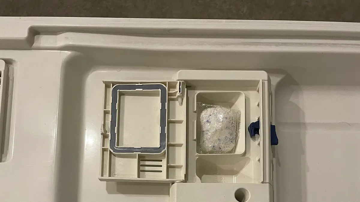 Detergent compartment on a dishwasher door