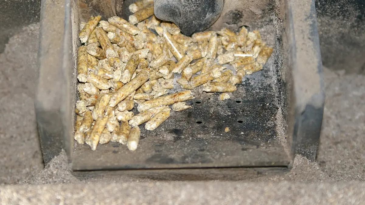 Burn pot of a pellet stove with pellets inside before ignition