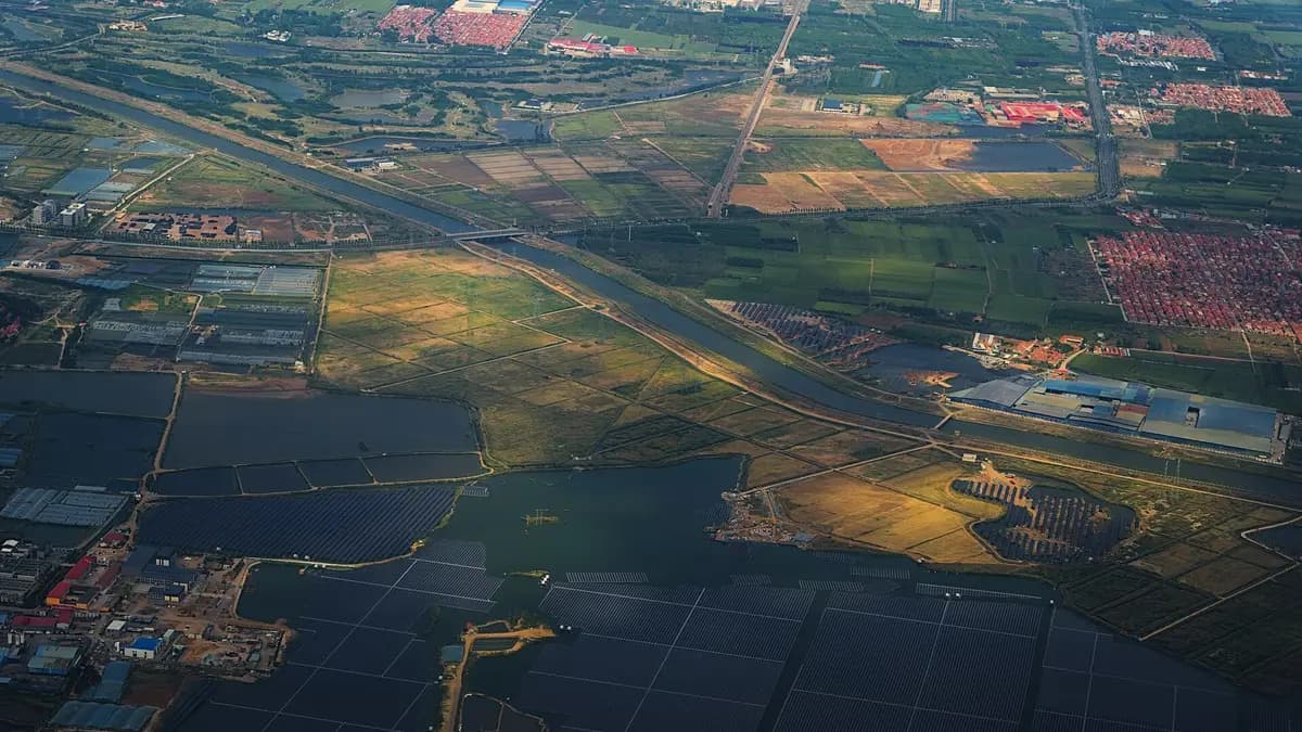 Aerial view of solar panels next to aquaculture ponds on the outskirts of Qingdao, China